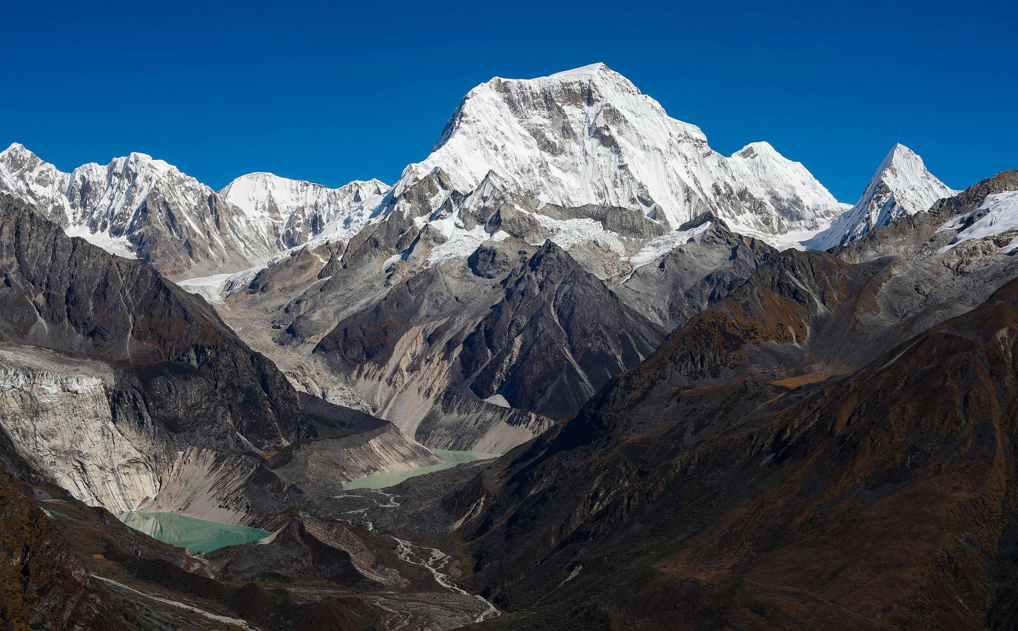 Snow-capped Himalayan peaks above glacial lakes in Bhutan
